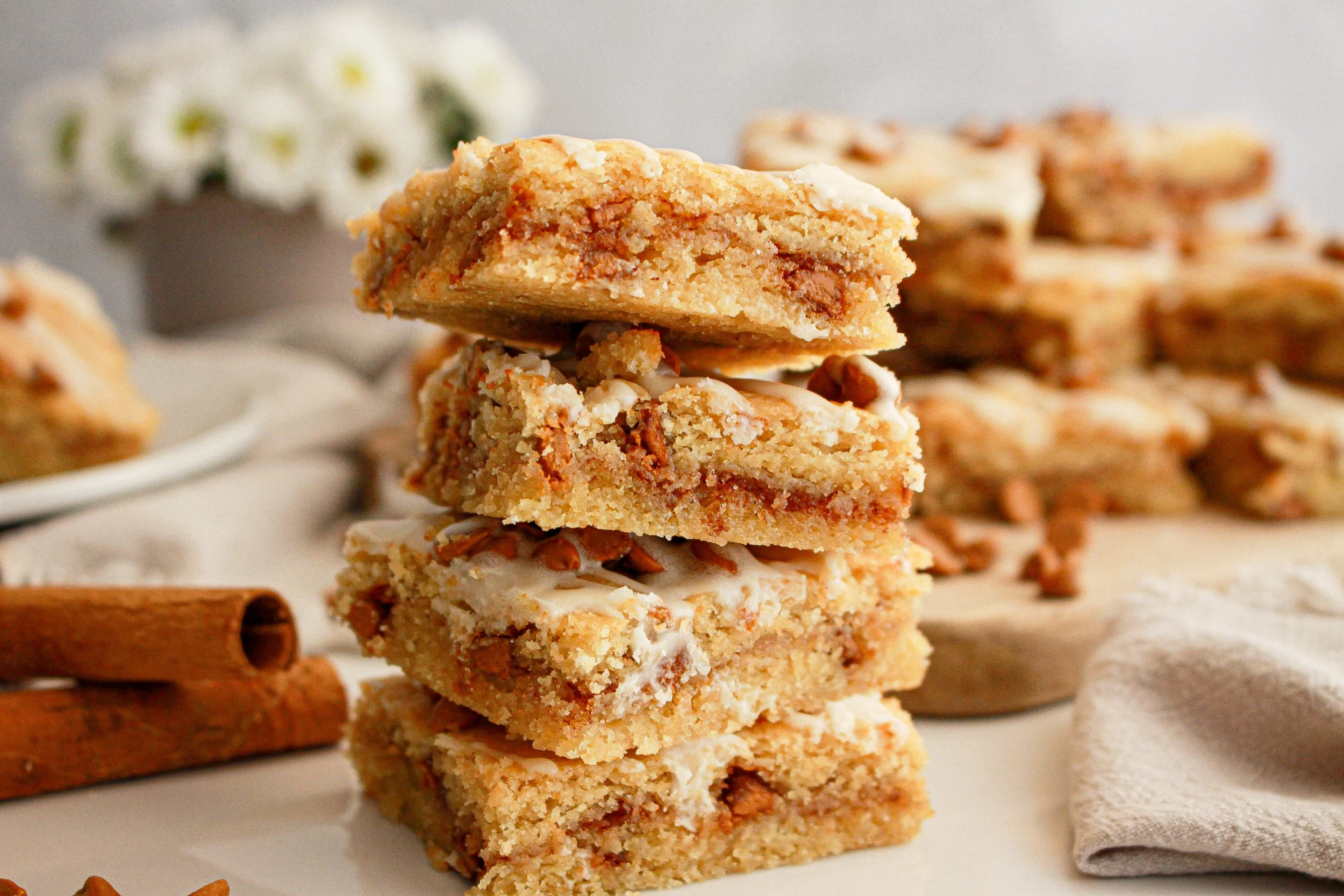 Stack of cinnamon blondies with icing