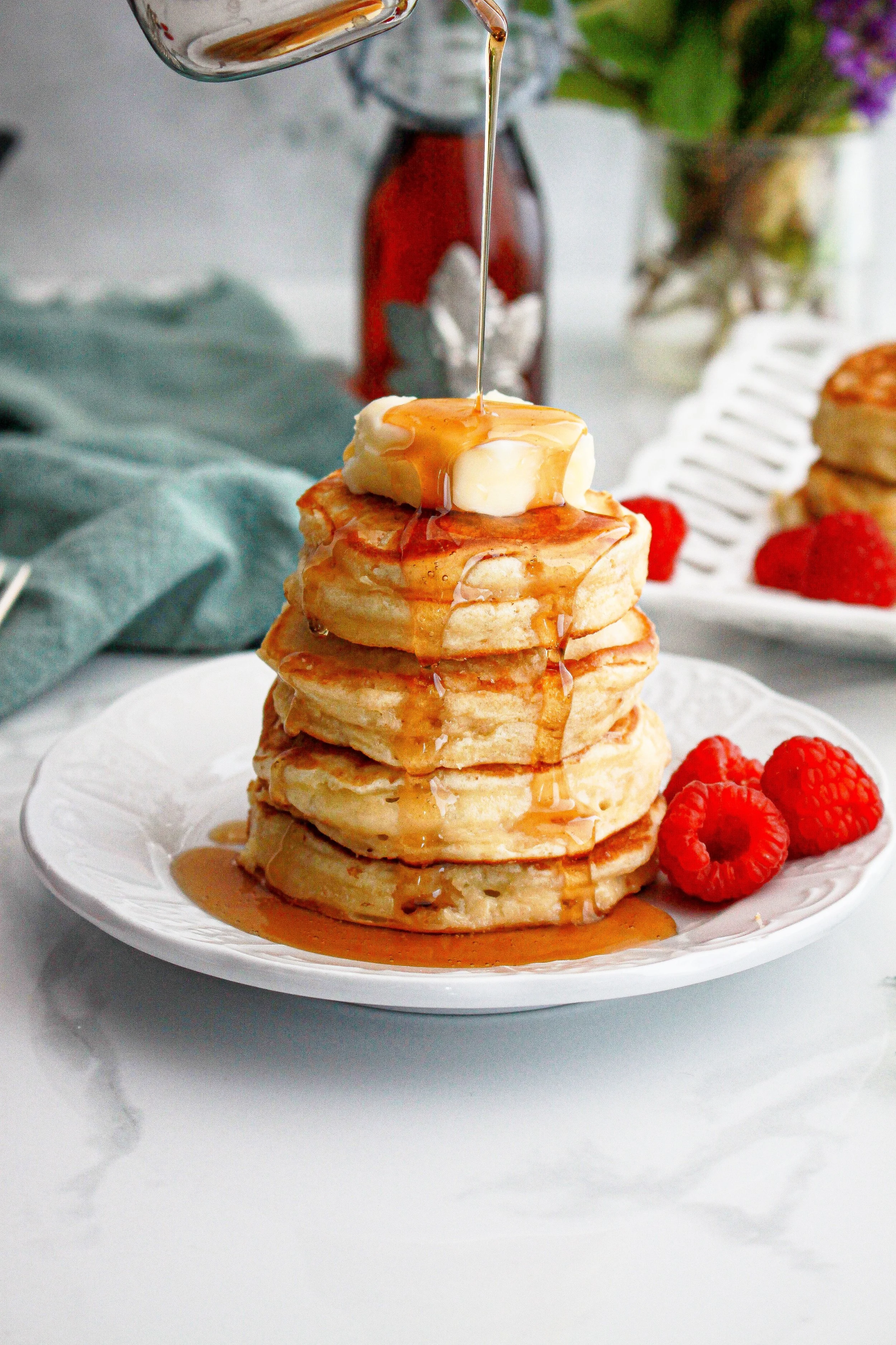 Stack of pancakes with butter and syrup