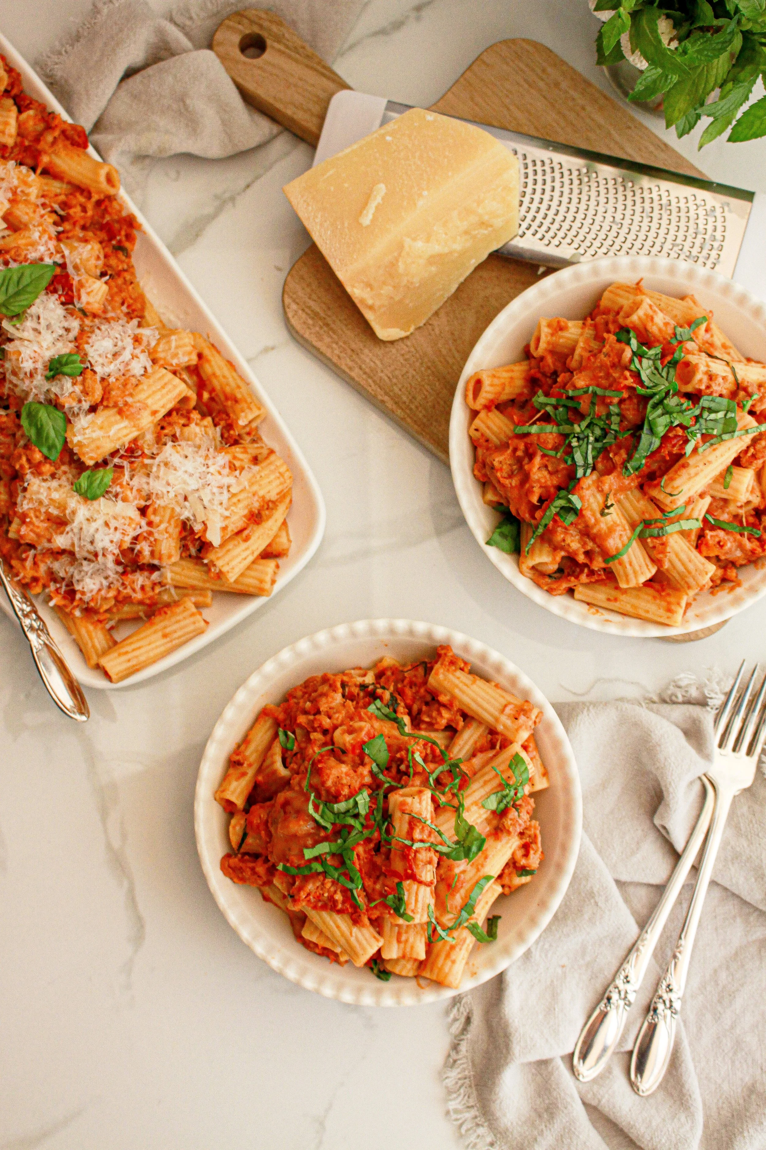Rigatoni pasta with tomato sauce and fresh basil